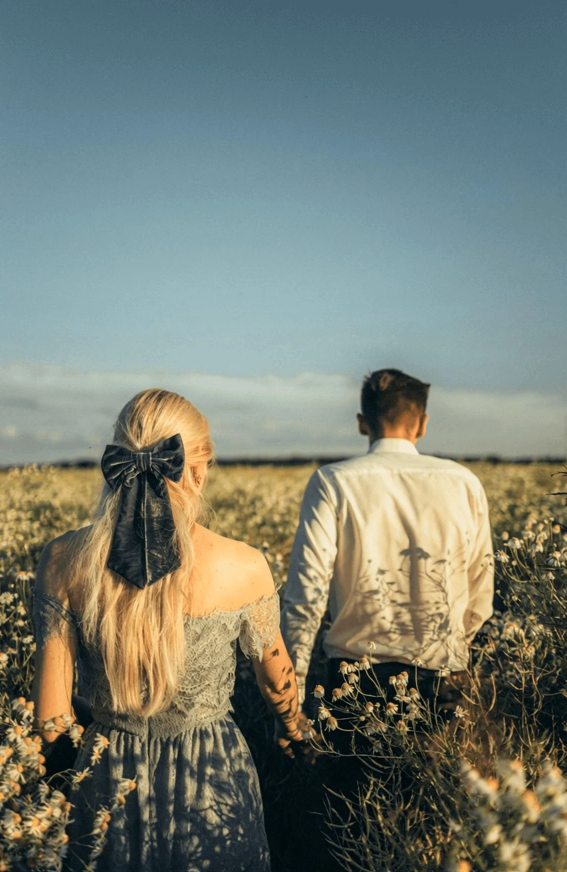 Starting frame for a couple moving through flowers